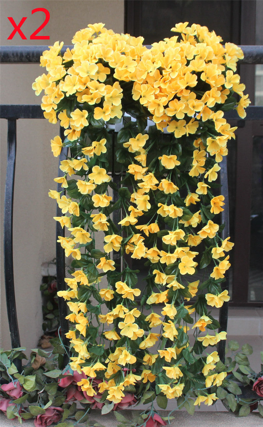 Violet Vines Hanging From Fake Flowers On The Window Balcony