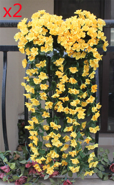 Violet Vines Hanging From Fake Flowers On The Window Balcony