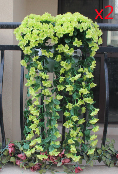 Violet Vines Hanging From Fake Flowers On The Window Balcony